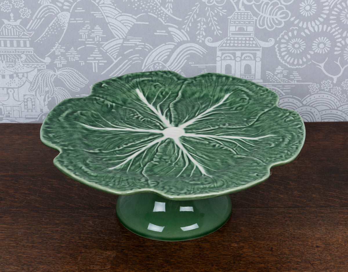 An earthenware green glazed cabbage leaf cake stand by Bordallo Pinhei Paradou