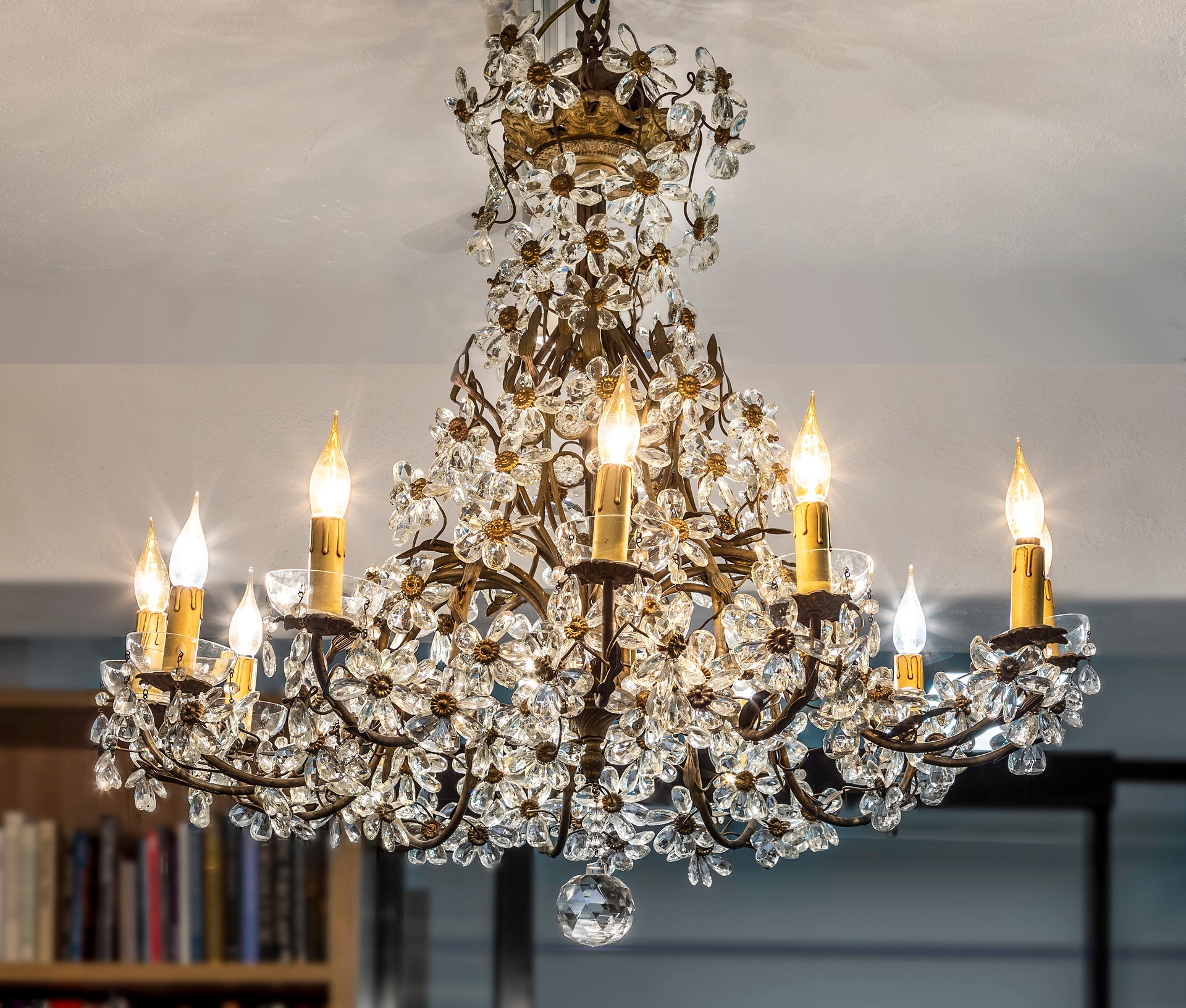 SOLD An exceptional pair of bronzed metal and crystal flowerhead chandeliers, French Circa 1940