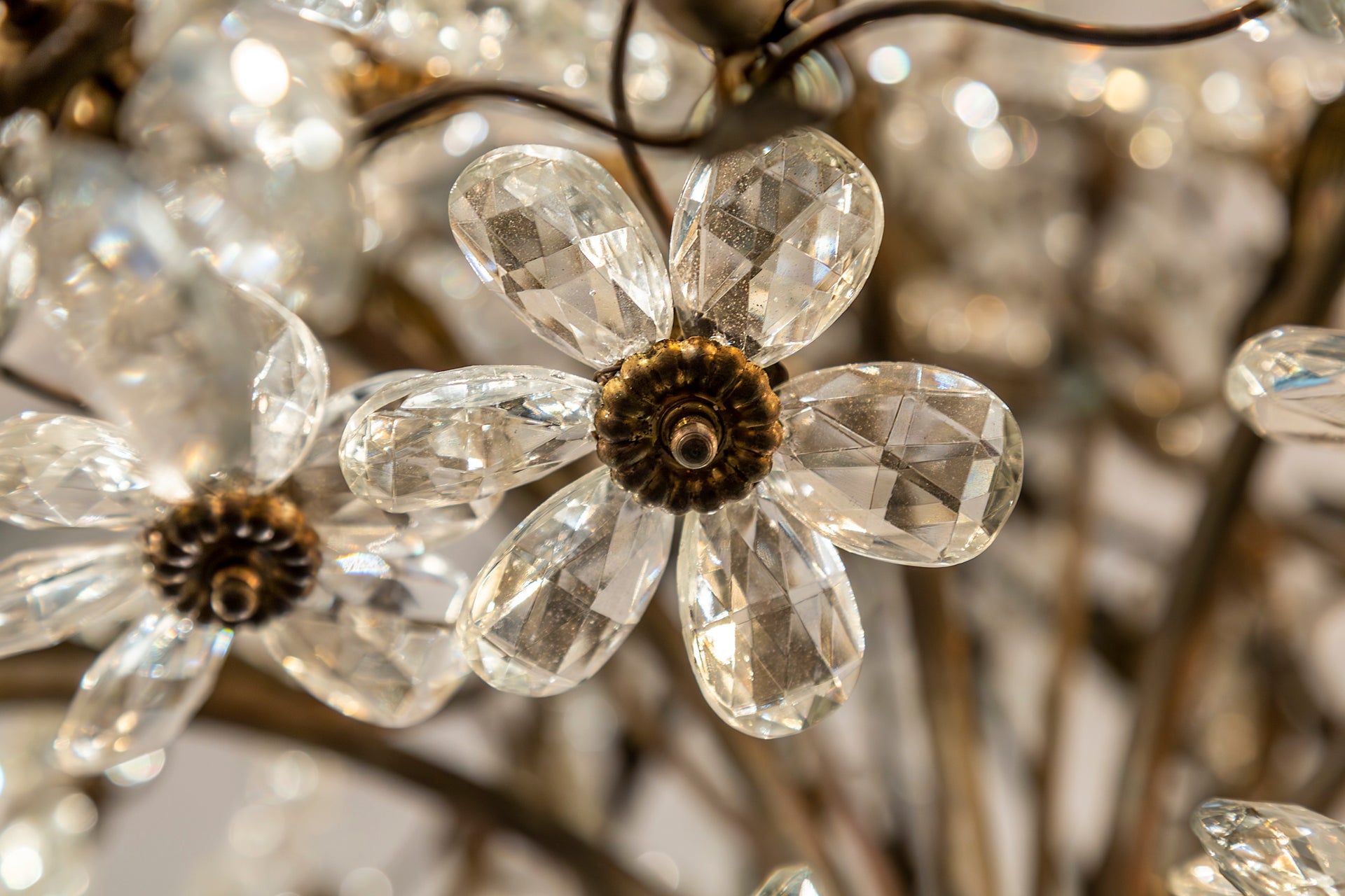 SOLD An exceptional pair of bronzed metal and crystal flowerhead chandeliers, French Circa 1940