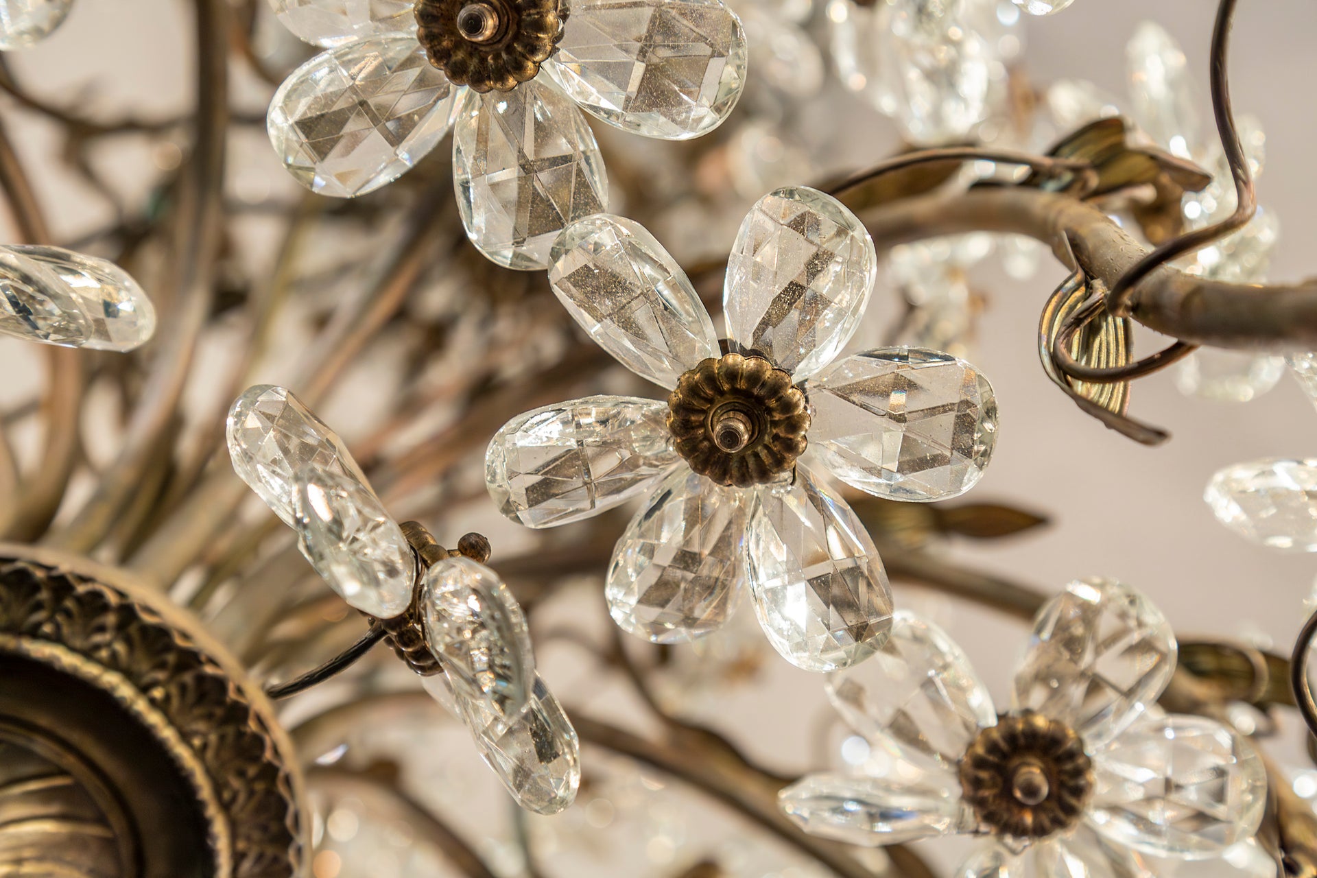 SOLD An exceptional pair of bronzed metal and crystal flowerhead chandeliers, French Circa 1940