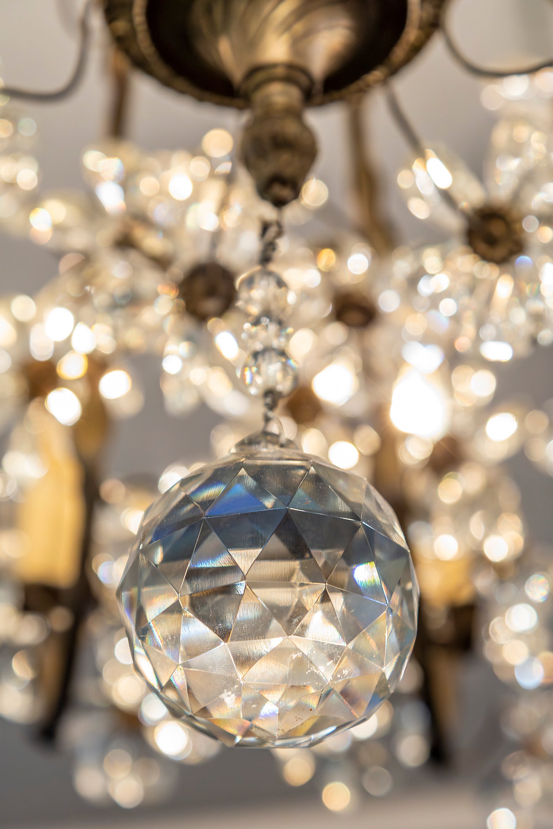 SOLD An exceptional pair of bronzed metal and crystal flowerhead chandeliers, French Circa 1940