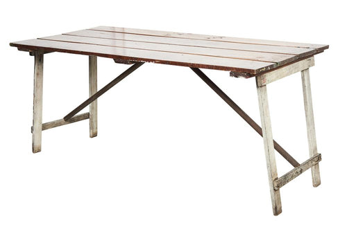 A unique and charming French rustic trestle style table with antique timber door top