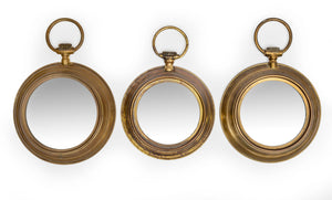 SOLD A brass pocket-watch wall mirror, Spanish Circa 1960