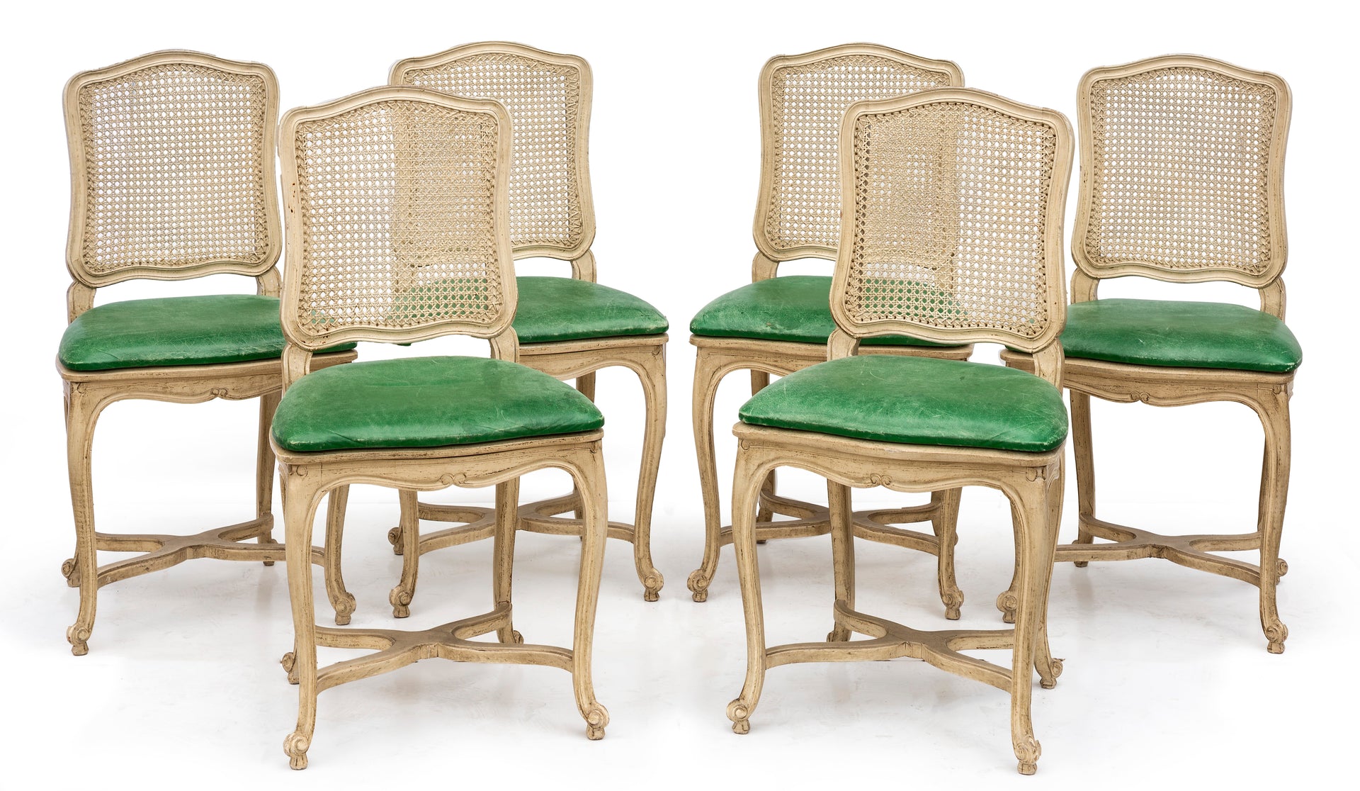 SOLD A stylish set of six white painted cane dining chairs, French Circa 1950