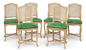 SOLD A stylish set of six white painted cane dining chairs, French Circa 1950