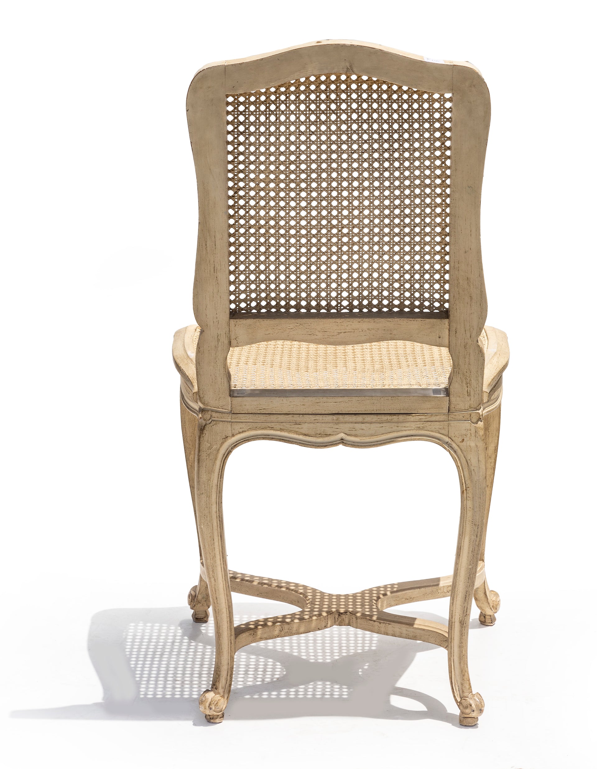 SOLD A stylish set of six white painted cane dining chairs, French Circa 1950