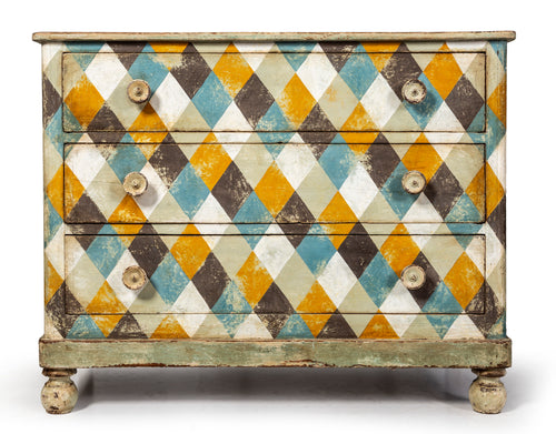 A striking rustic harlequin painted timber chest of drawers, Italian Circa 1900