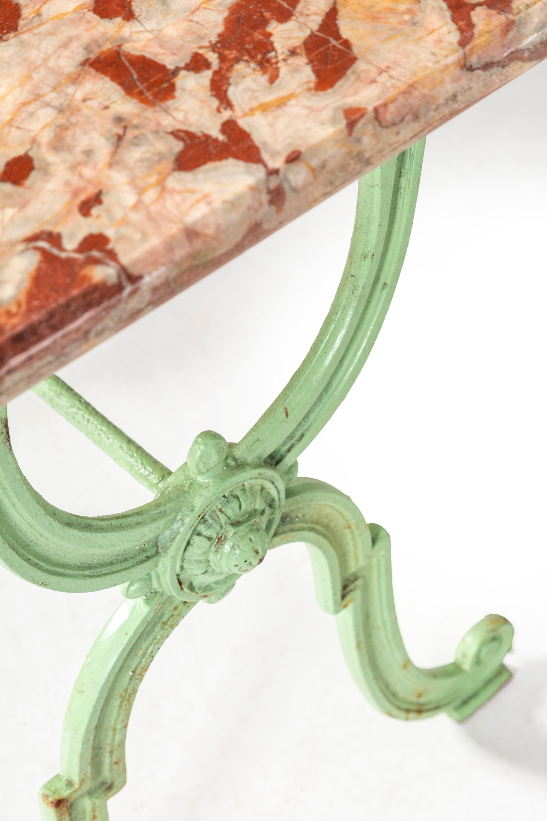 SOLD A magnificent pale green painted cast iron table with honed rouge marble top, French 19th Century