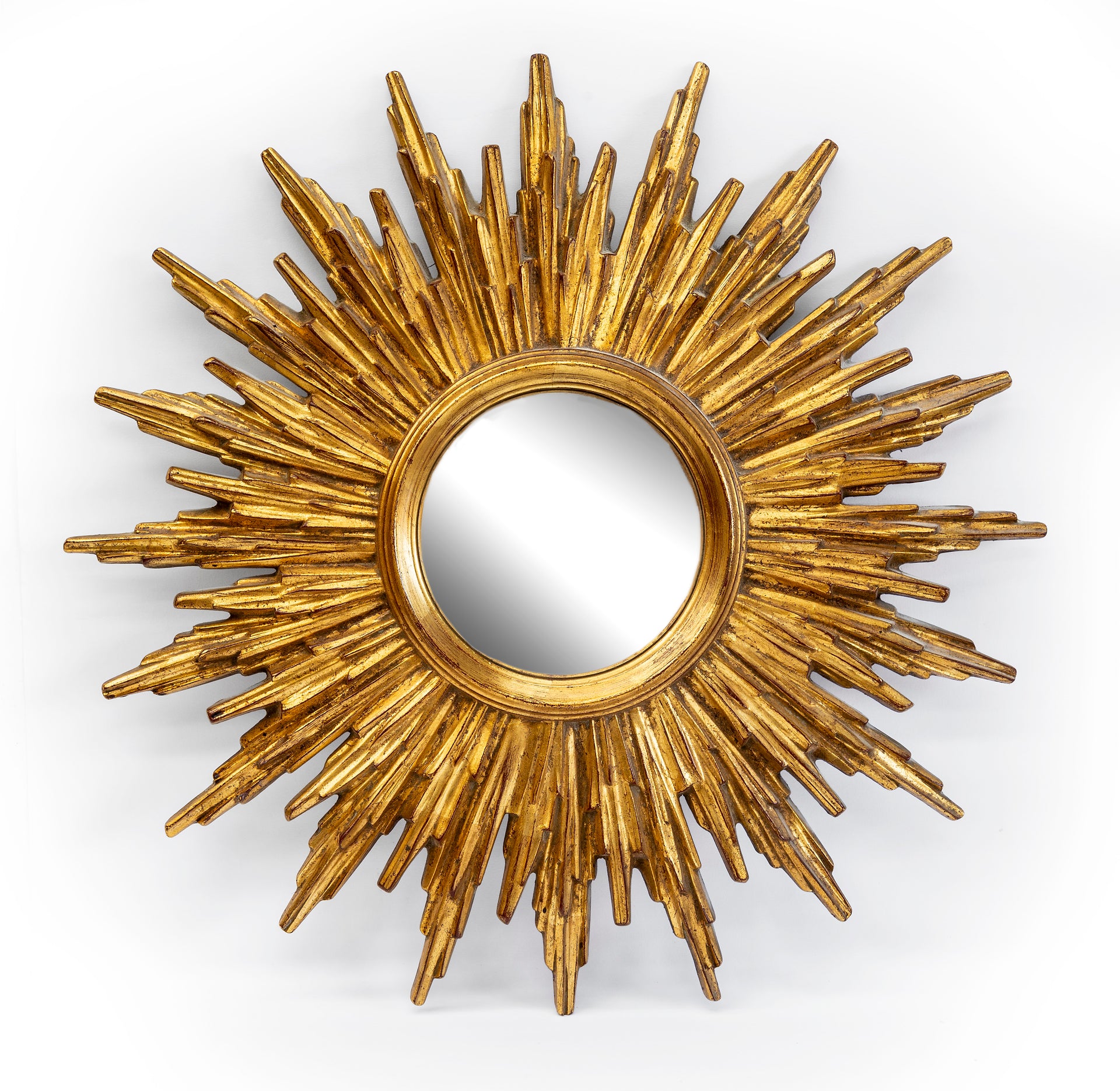 SOLD A well moulded gilt resin sunburst wall mirror, French circa 1950