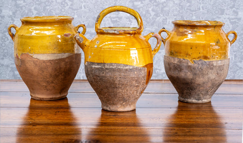 A selection of lovely terrcotta mustard glazed confit jars, and one ewer, French 19th Century