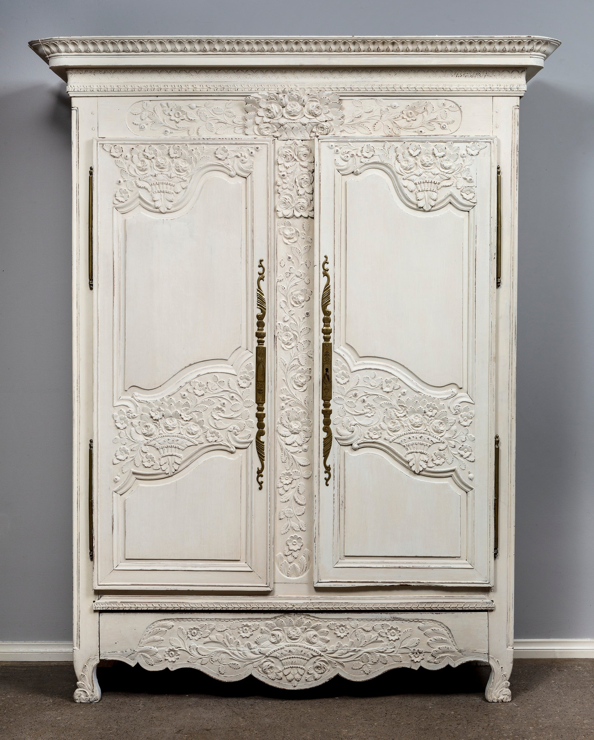 SOLD A beautifully carved white painted oak armoire of attractive proportions, French early 19th Century