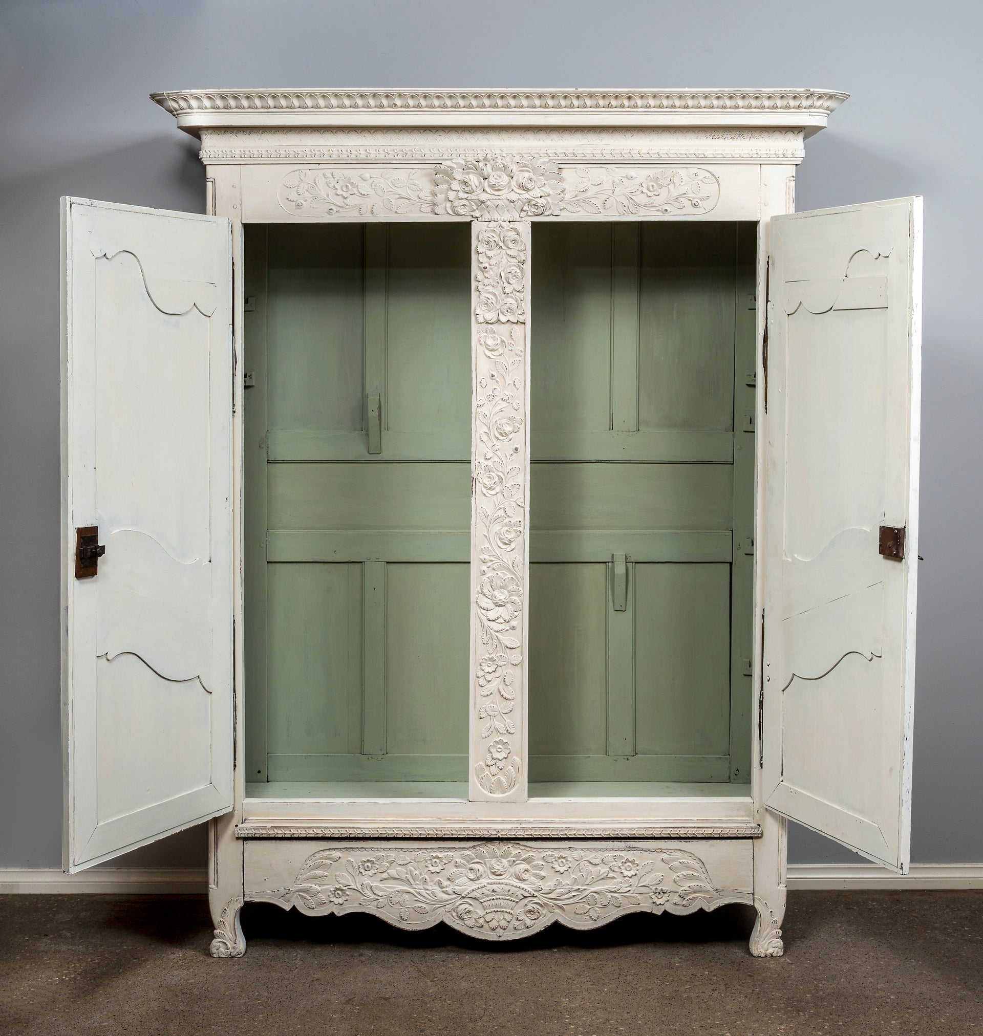 SOLD A beautifully carved white painted oak armoire of attractive proportions, French early 19th Century