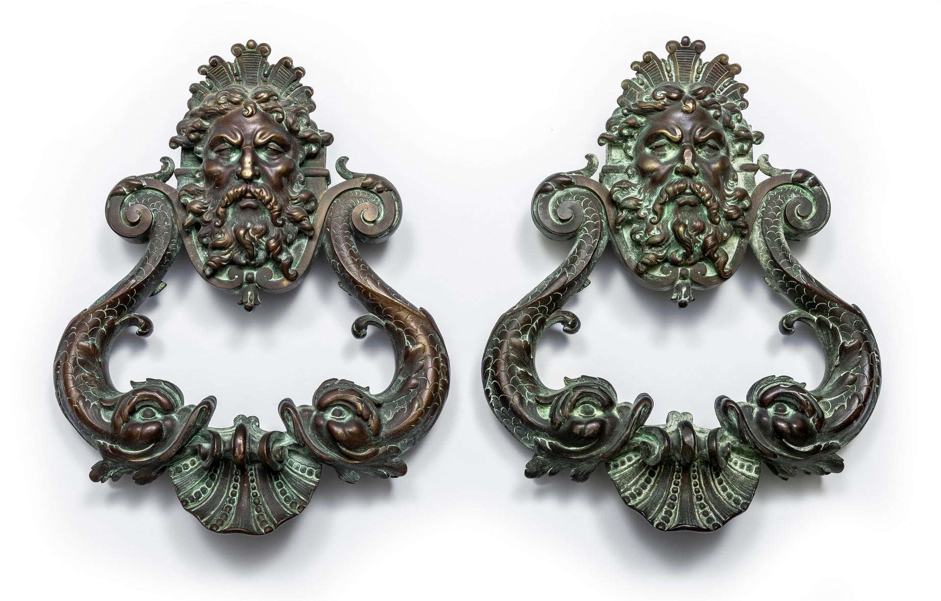 SOLD An exceptional pair of bronze door knockers, cast with the head of Neptune and twin dolphins French 19th Century