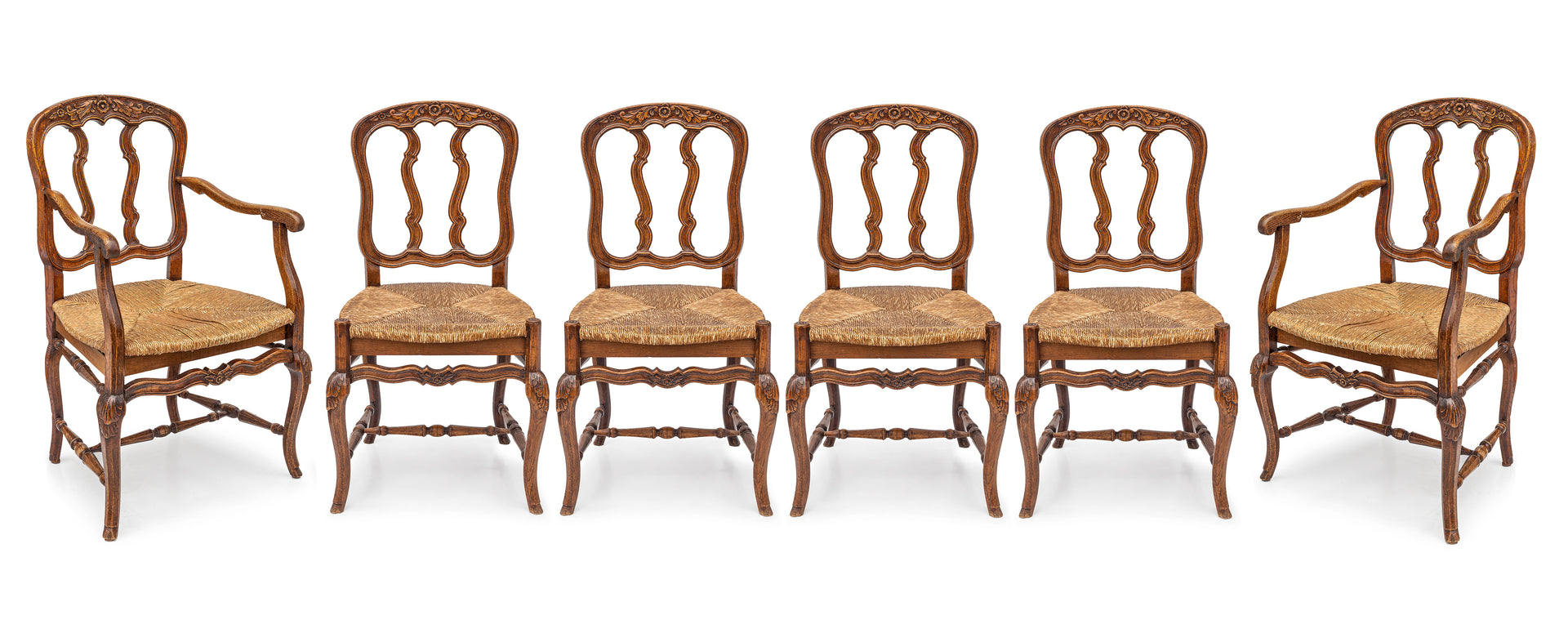 SOLD A lovely set of six carved fruitwood chairs with rush seats, French 19th Century