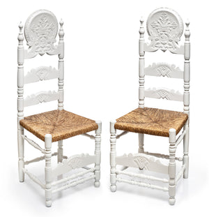 SOLD A very decoratively carved pair of white painted provincial hall chairs, French 19th Century