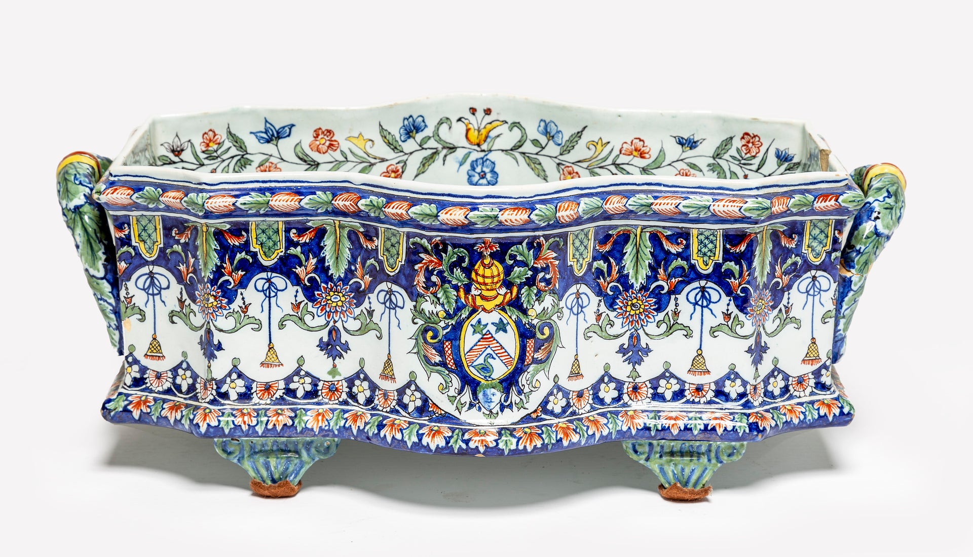 SOLD An impressive polychrome painted faience serpentine shaped jardiniere, French 19th Century with twin handles