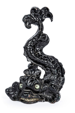 SOLD A whimsical black painted cast iron doorstop in the form of a sea monster, English 19th Century