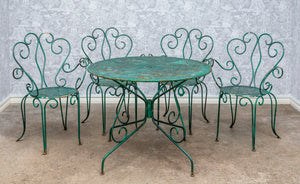 SOLD A very pretty dark green painted wrought iron garden table and four chair setting, French circa 1950