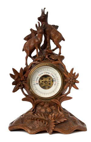 SOLD A finely carved desk barometer with two chamois, Black Forest region 19th Century