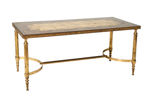 SOLD A fine quality coffee table in brass and glass, the ruby and gilt glass top decorated with arabesques, attributed to Maison Baguès, Paris Circa 1940