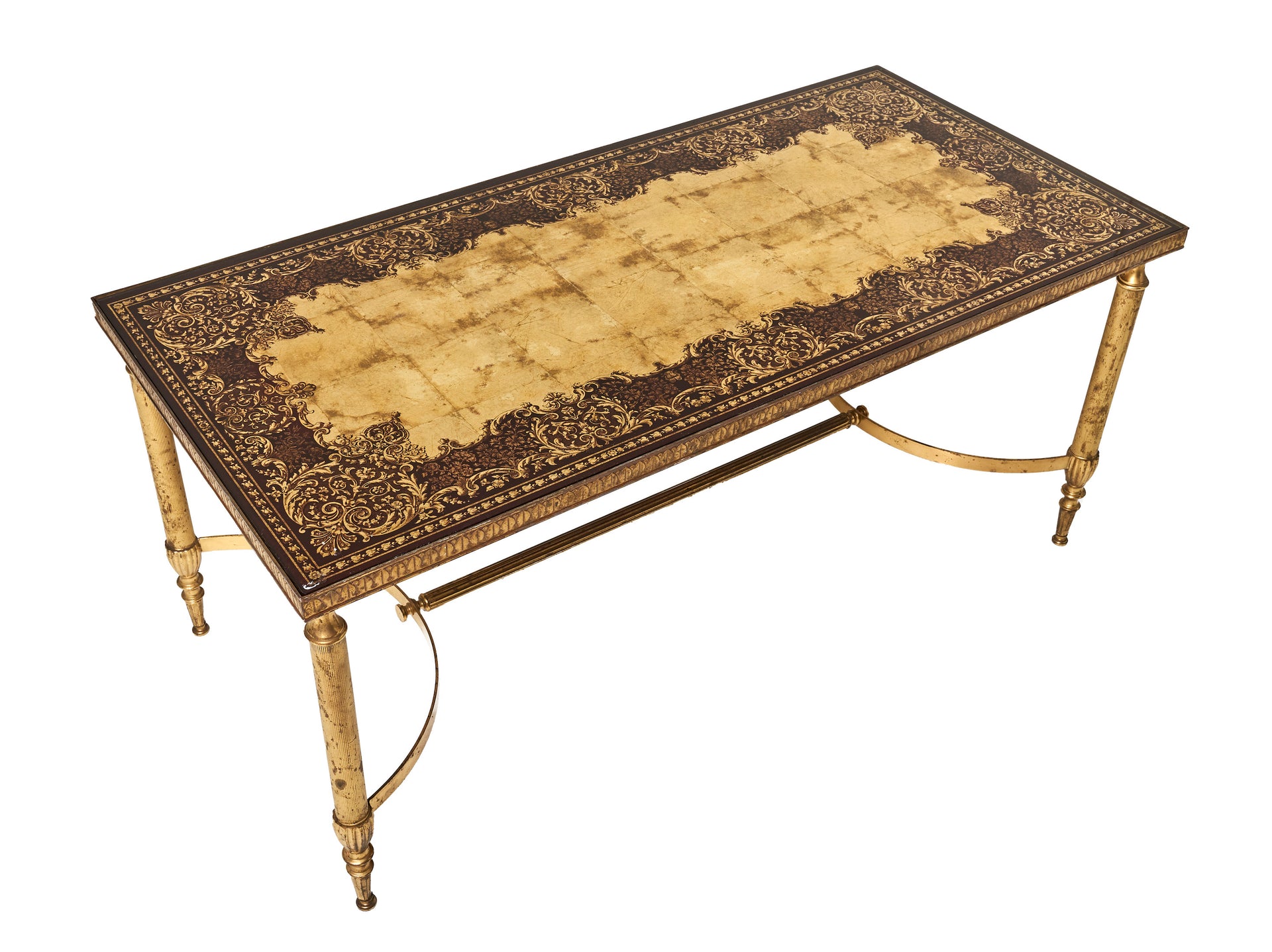 SOLD A fine quality coffee table in brass and glass, the ruby and gilt glass top decorated with arabesques, attributed to Maison Baguès, Paris Circa 1940