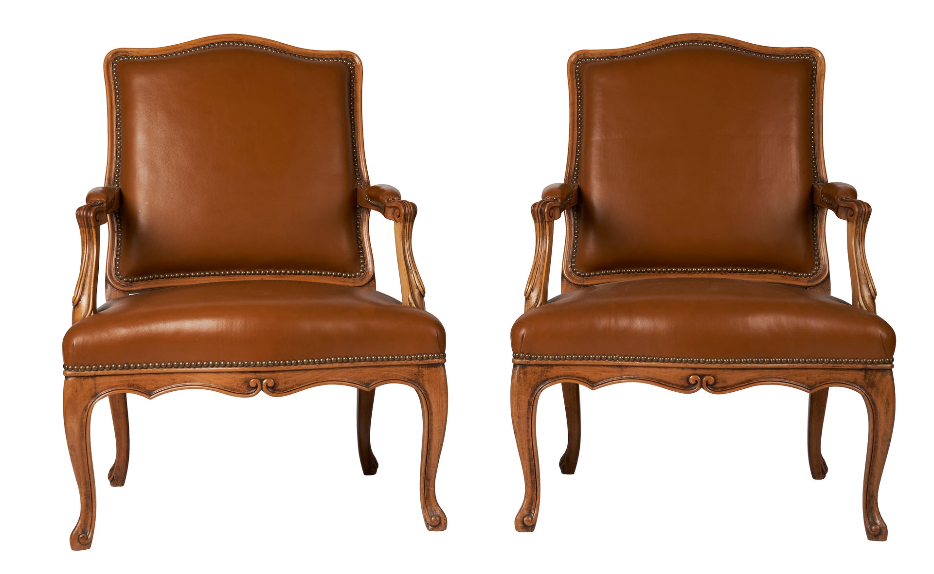 SOLD A pair of natural wood armchairs with flat backs, upholstered in tobacco leather, Louis XV Style French Circa 1920