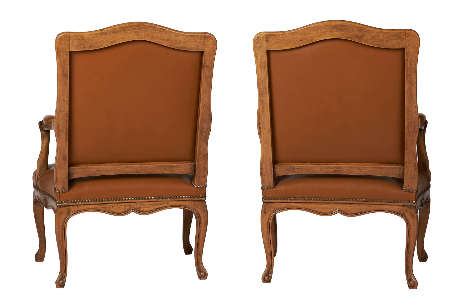 SOLD A pair of natural wood armchairs with flat backs, upholstered in tobacco leather, Louis XV Style French Circa 1920
