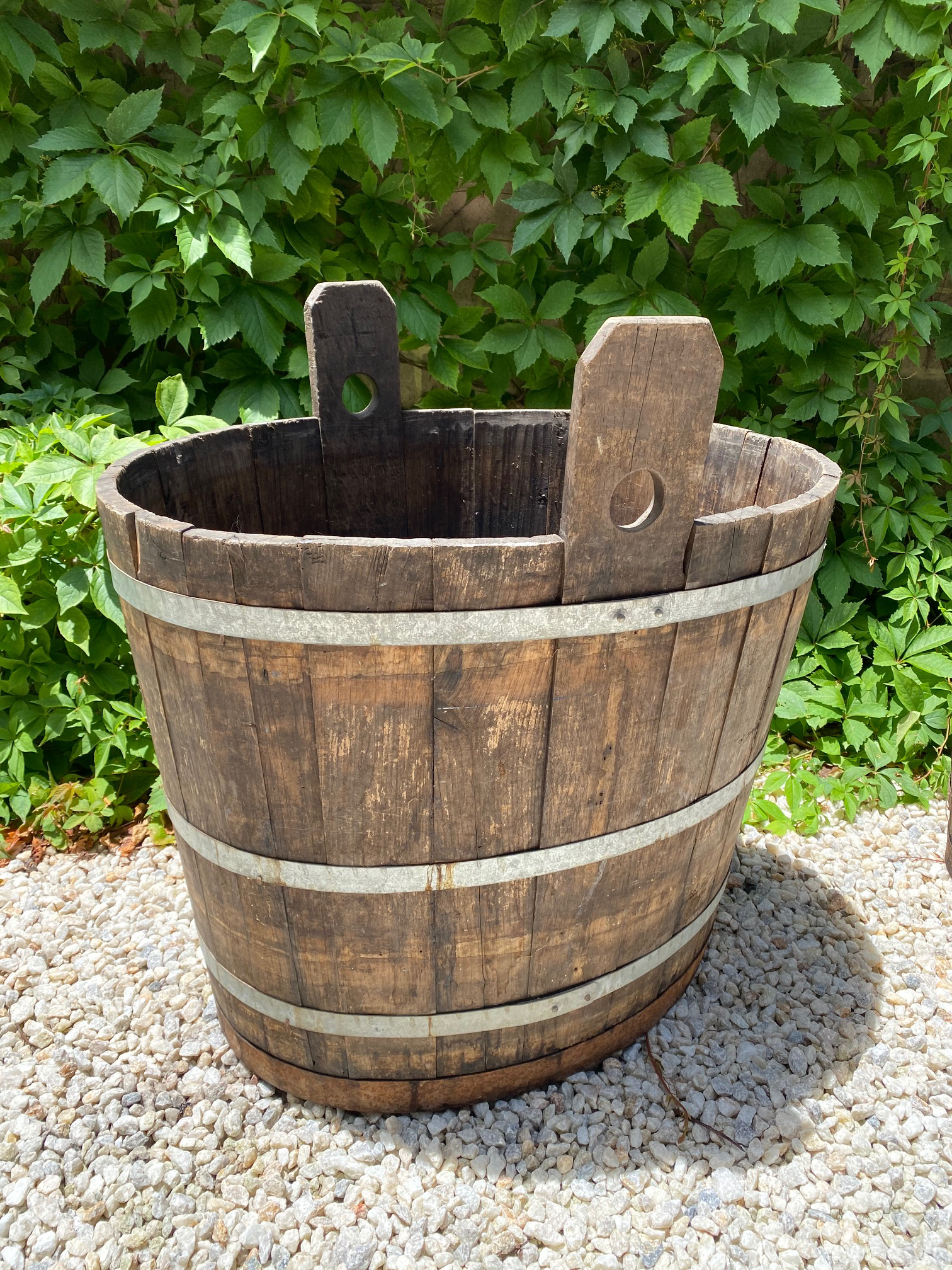 SOLD A giant oval, coopered oak and metal banded grape harvesting tub, French 19th Century