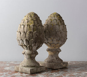 SOLD A pair of composite stone French fir-cone finials