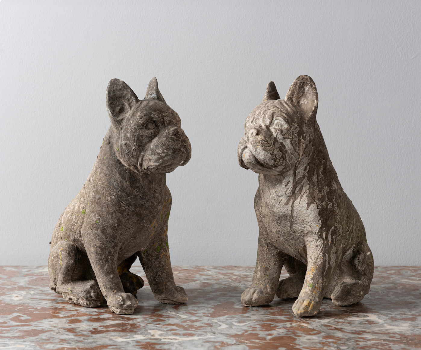 SOLD A pair of composite stone French bulldogs