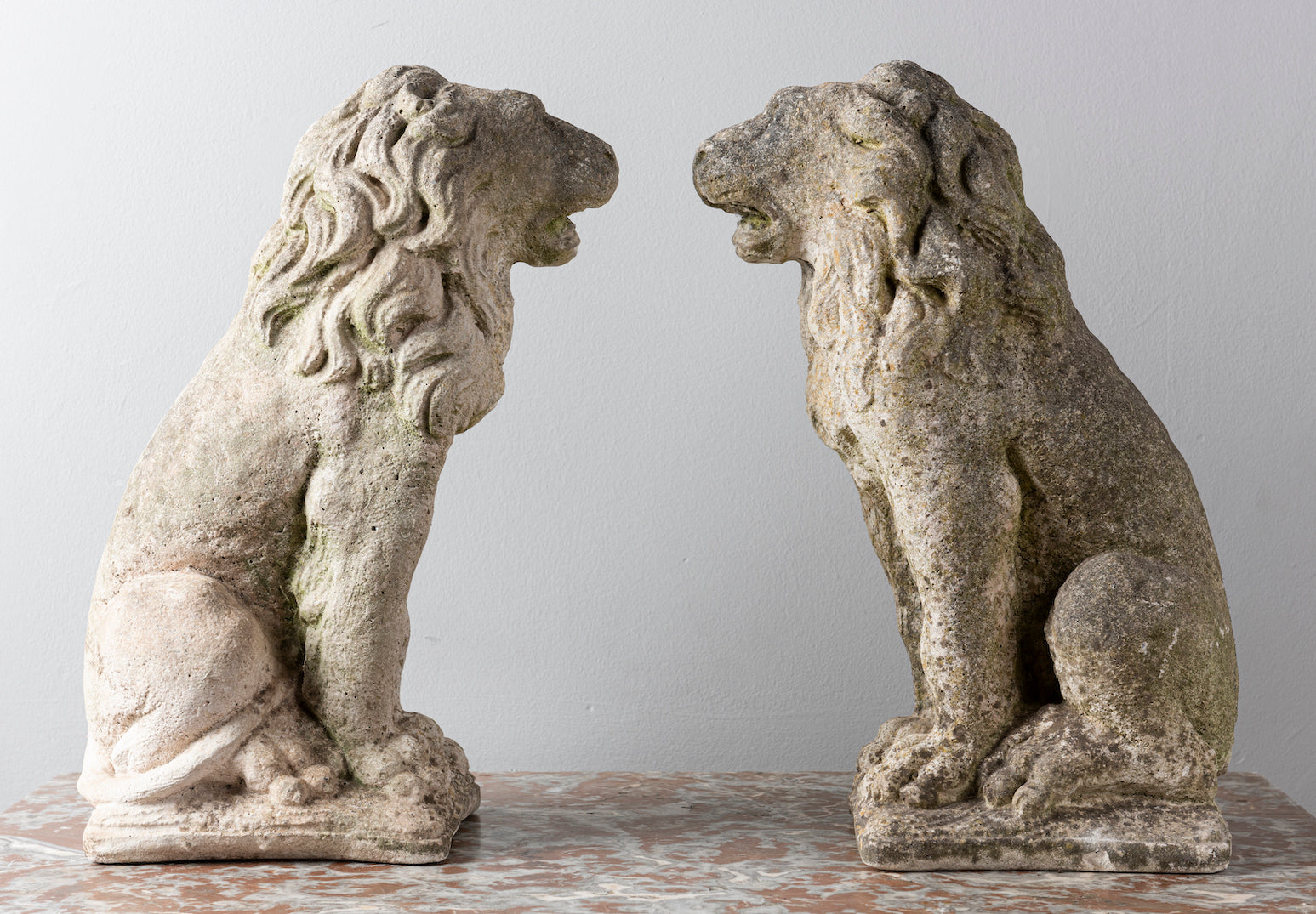 SOLD A pair of French vintage composite stone seated lions