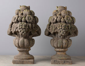 SOLD A pair of French composite stone fruit and urn finials