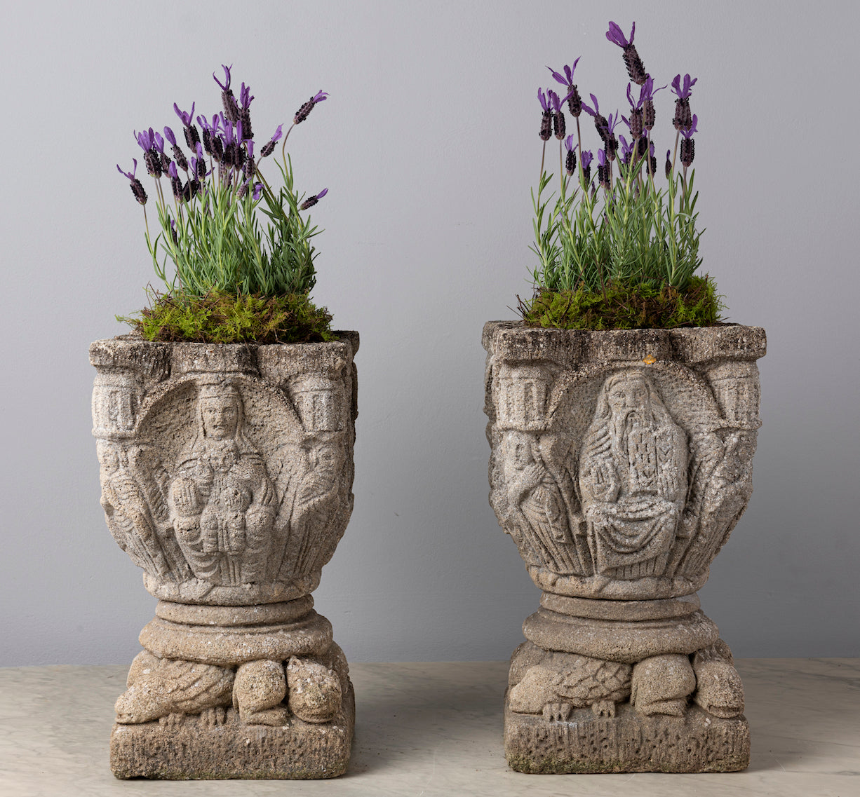 SOLD An unusual pair of carved stone jardinieres on carved stone bases in the French Medieval style, Circa 1900