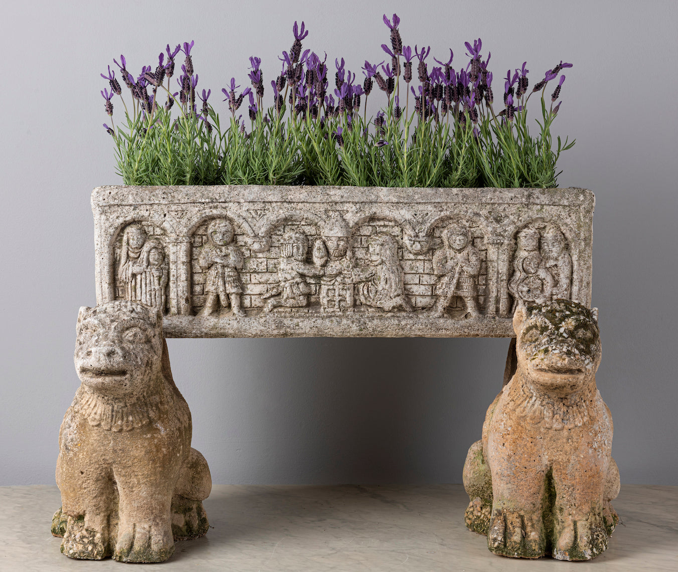 SOLD An unusual carved stone medieval style planter with carved composite stone mythical animal supports, French 18/19th Century