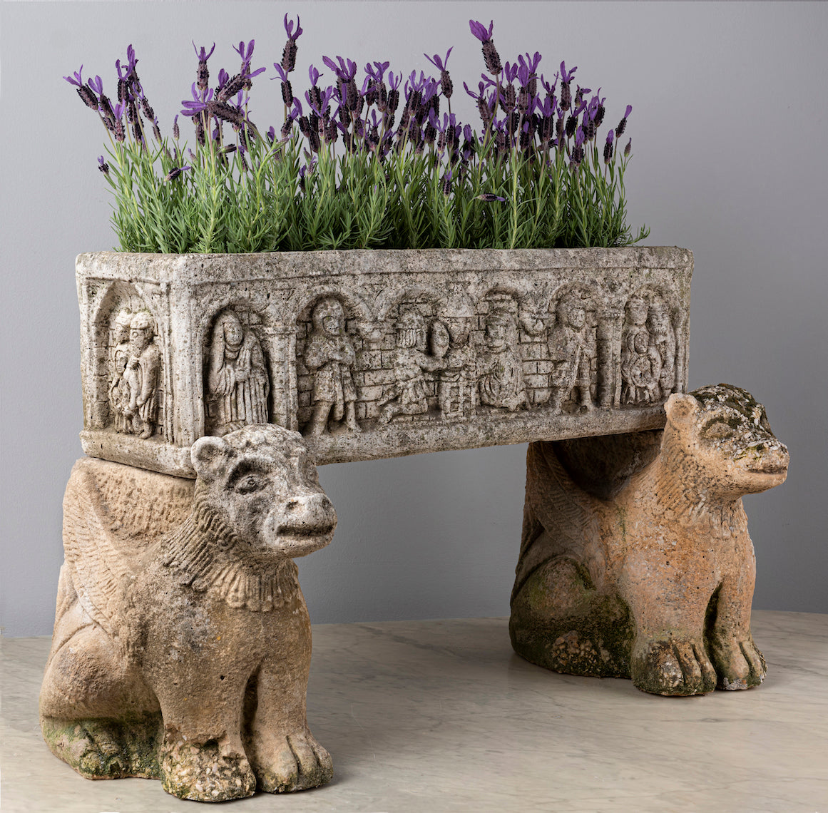SOLD An unusual carved stone medieval style planter with carved composite stone mythical animal supports, French 18/19th Century