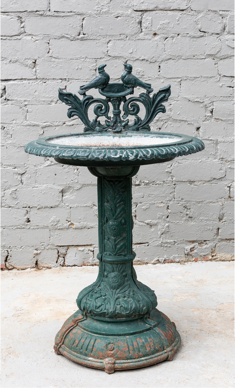 SOLD A vintage green painted cast iron pedestal bird bath