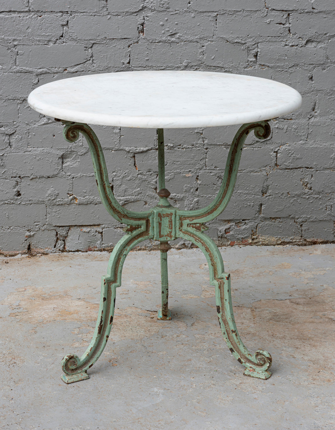 SOLD A pale green painted cast iron tri-form garden table, French 19th Century