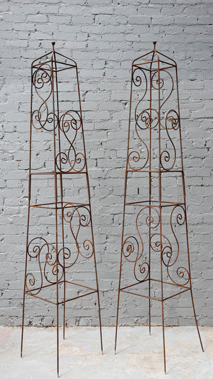 SOLD A pair of very decorative and tall  iron plant trainers,
