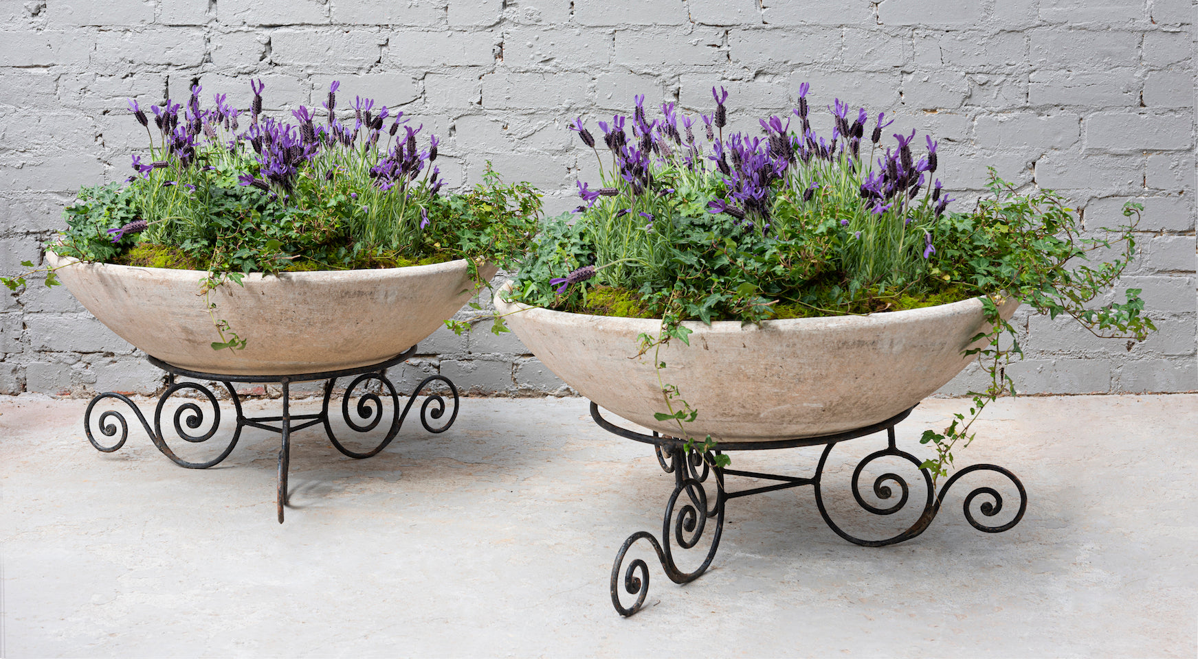 SOLD A pair of circular vintage jardinieres on decorative black iron bases, French Circa 1950