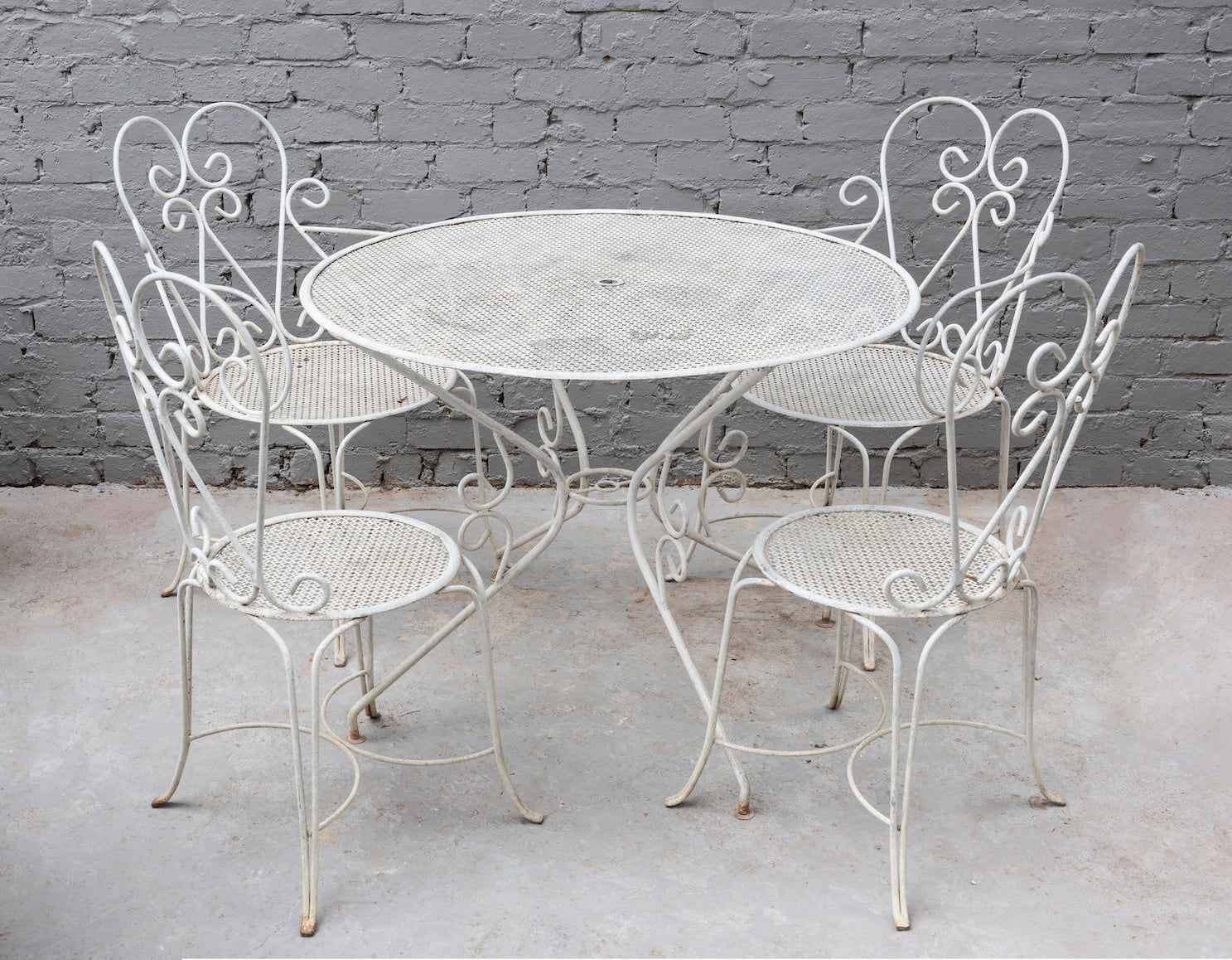 SOLD A white painted metal five piece garden setting, French Circa 1950
