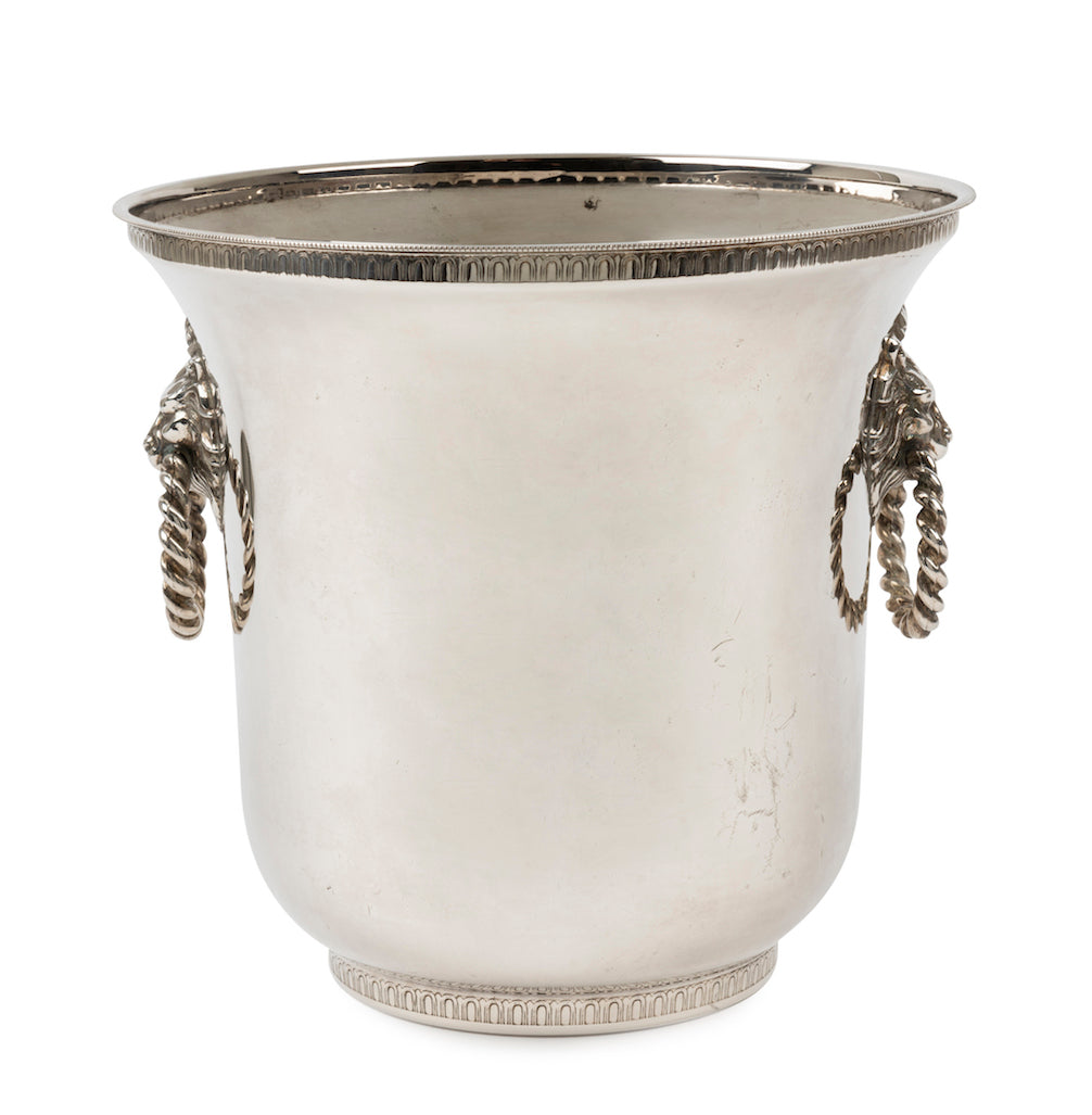 SOLD A silver plated circular wine cooler with lion mask ring handles, French Circa 1950