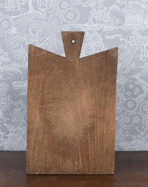 SOLD A solid timber chopping board, French 19th Century with lug end for hanging,