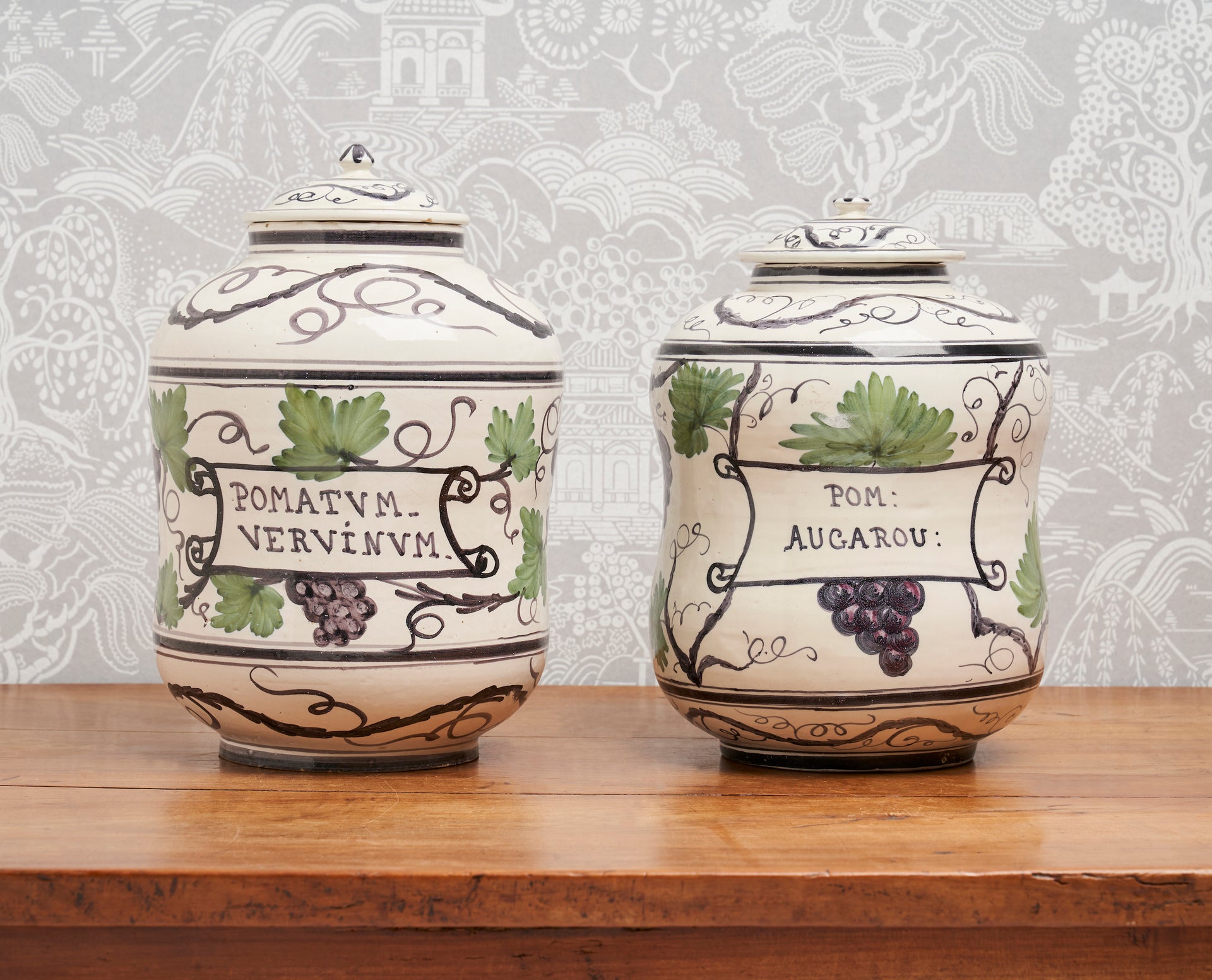 SOLD A stylish pair of polychrome painted faience lidded jars, French Circa 1900
