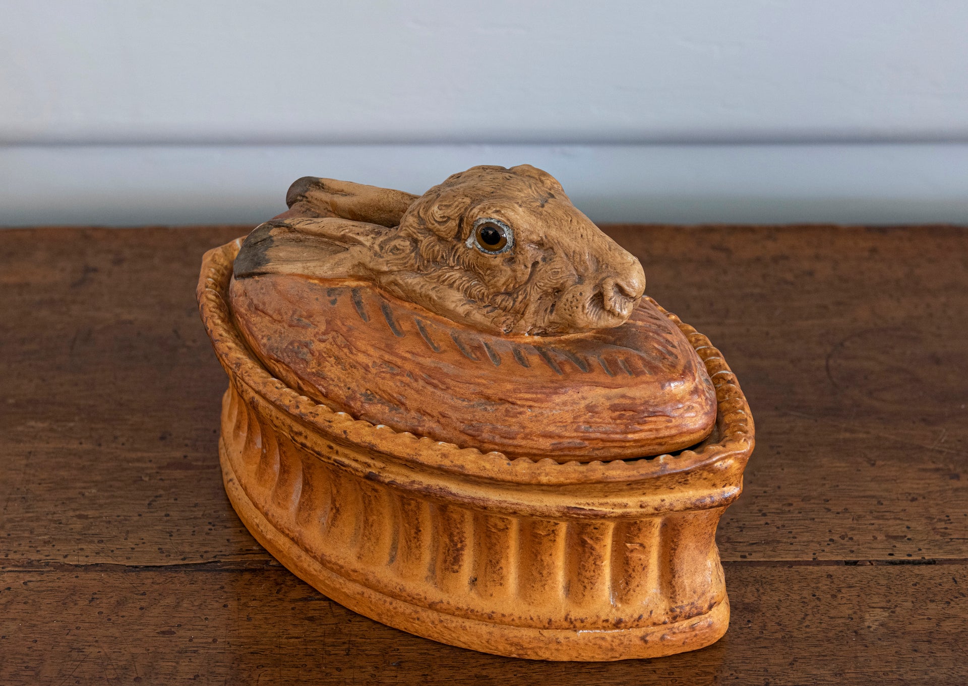 SOLD A stoneware tureen and cover in the form of a hares head with glass eyes, French 19th Century