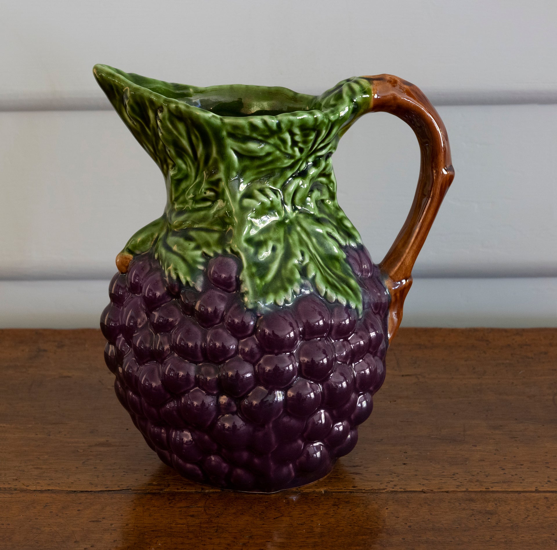 SOLD An appealing vintage French faience wine or water jug moulded with grapes