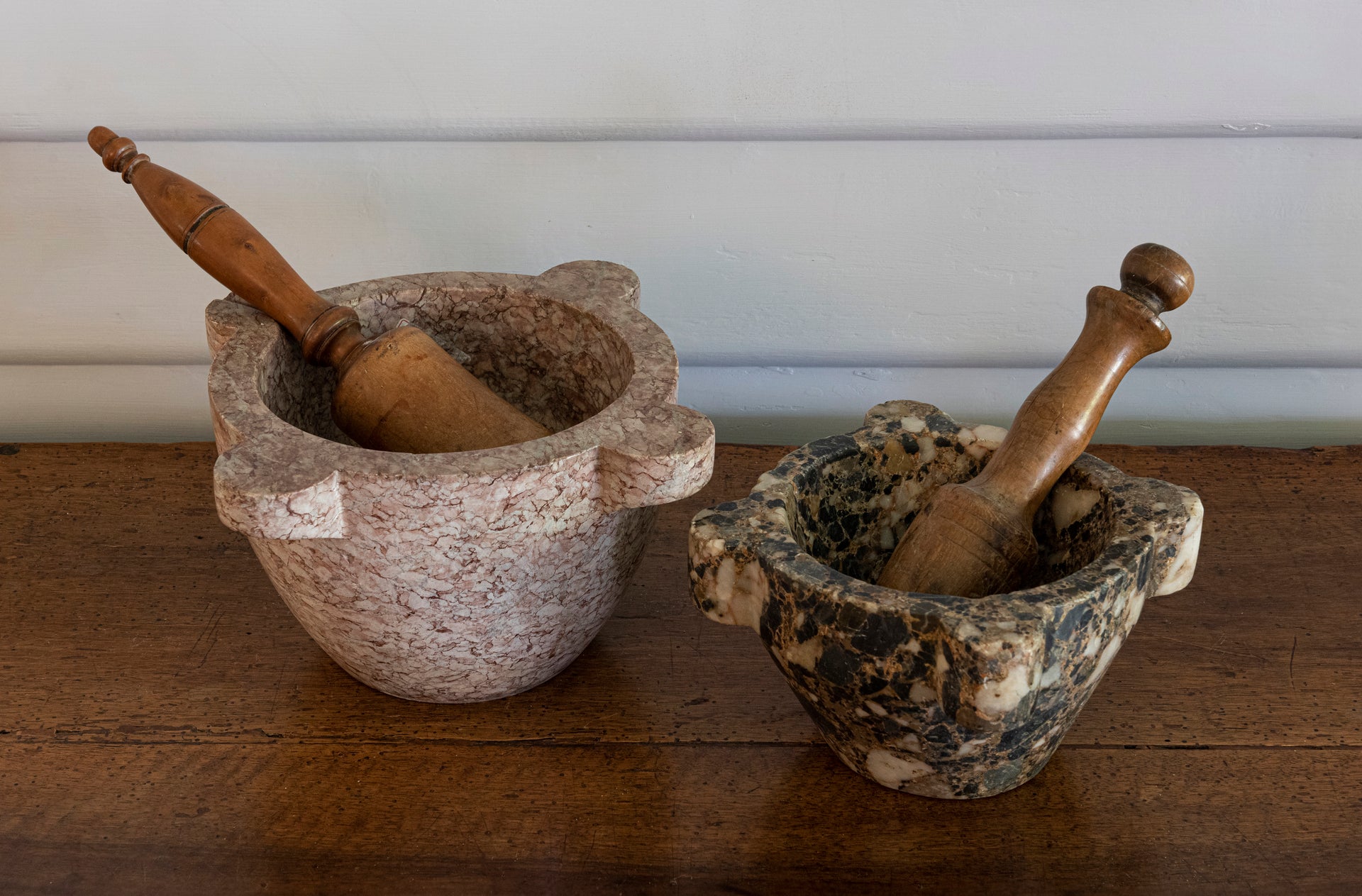 SOLD A rose- pink marble carved mortar with turned fruitwood pestle, French 19th Century