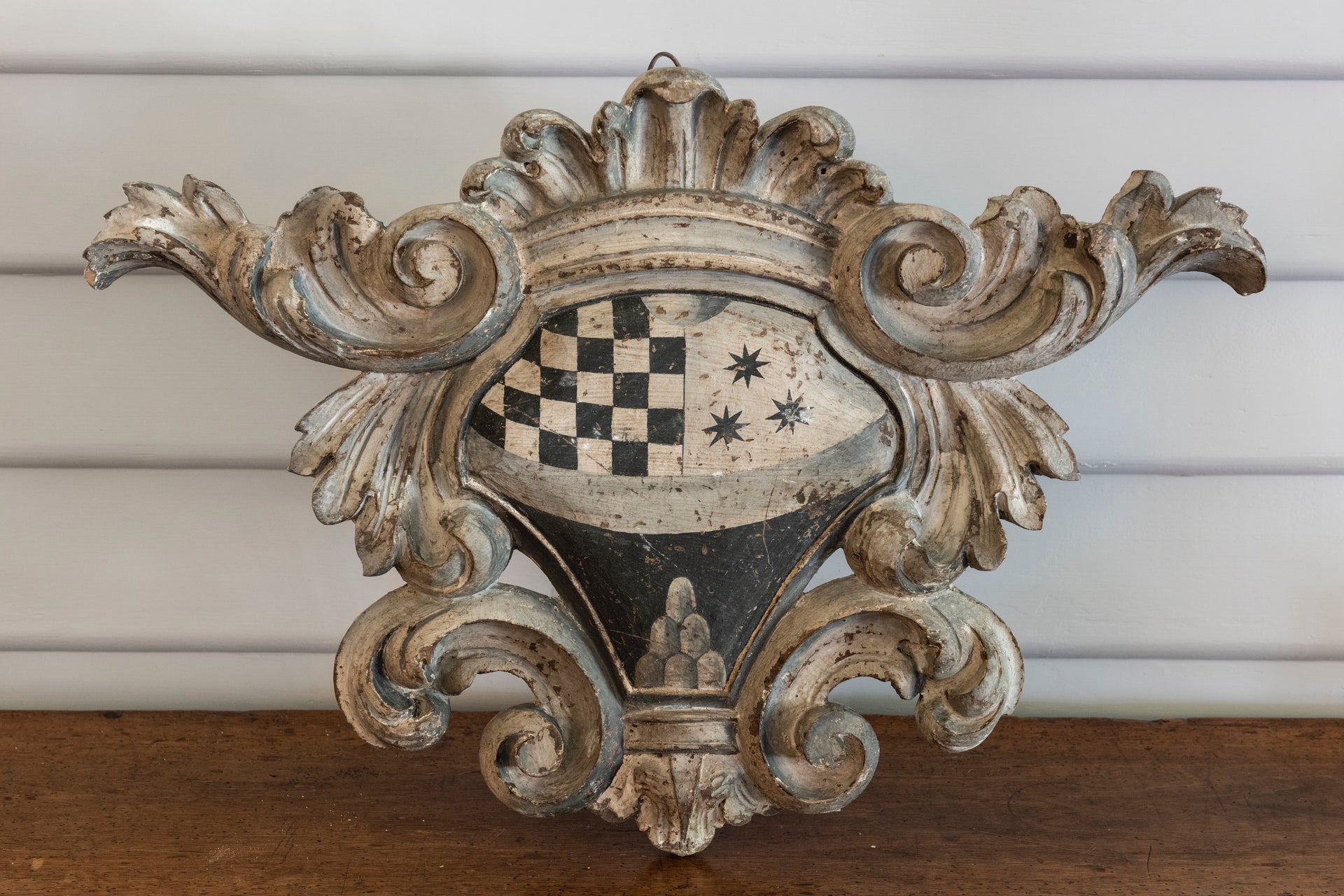 SOLD A very decorative Italian grey painted carved wooden coat of arms