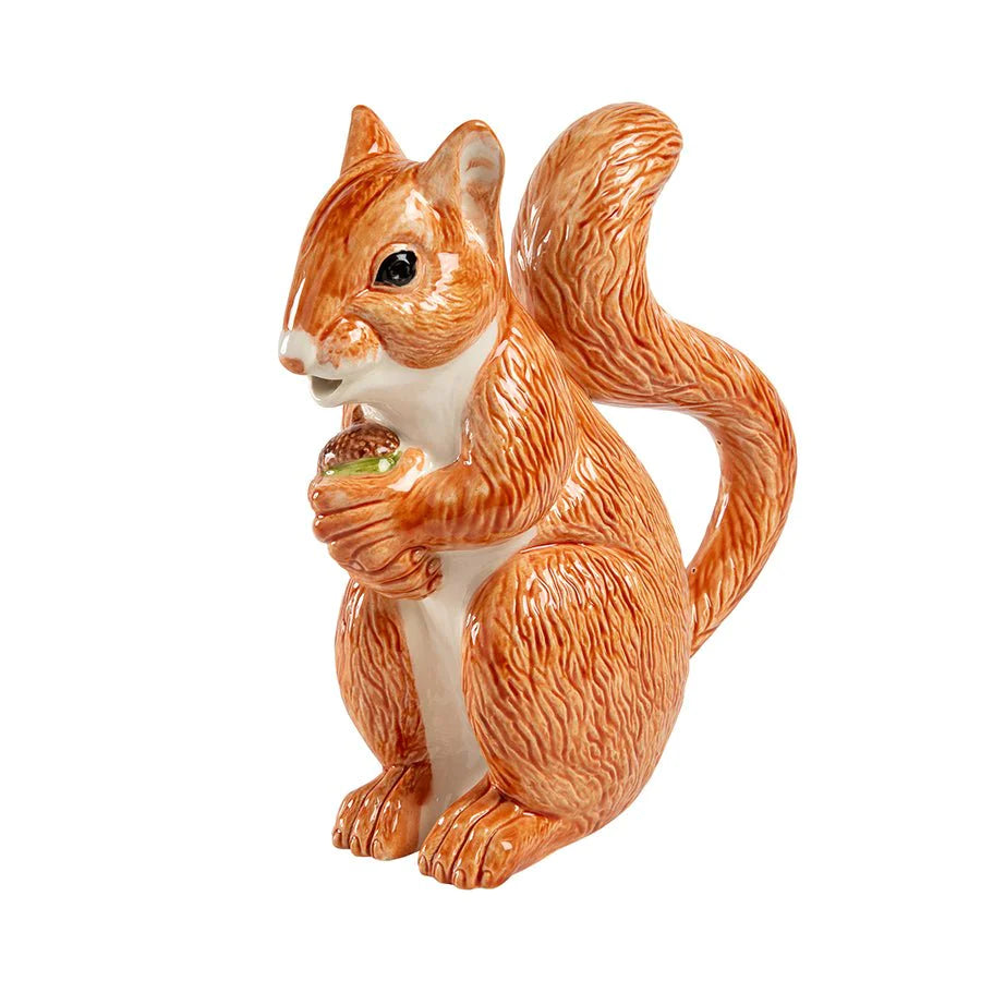 SOLD An earthenware pitcher in the form of a red squirrel holding an acorn by Bordallo Pinheiro, Portugal