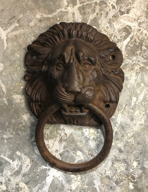 SOLD A cast iron lion mask and ring design door-knocker, French 19th Century