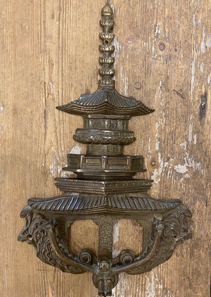 SOLD An unusual vintage Chinoiserie pagoda form and swinging monkey bronze door knocker 40cm high, 225cm wide, 4cm deep